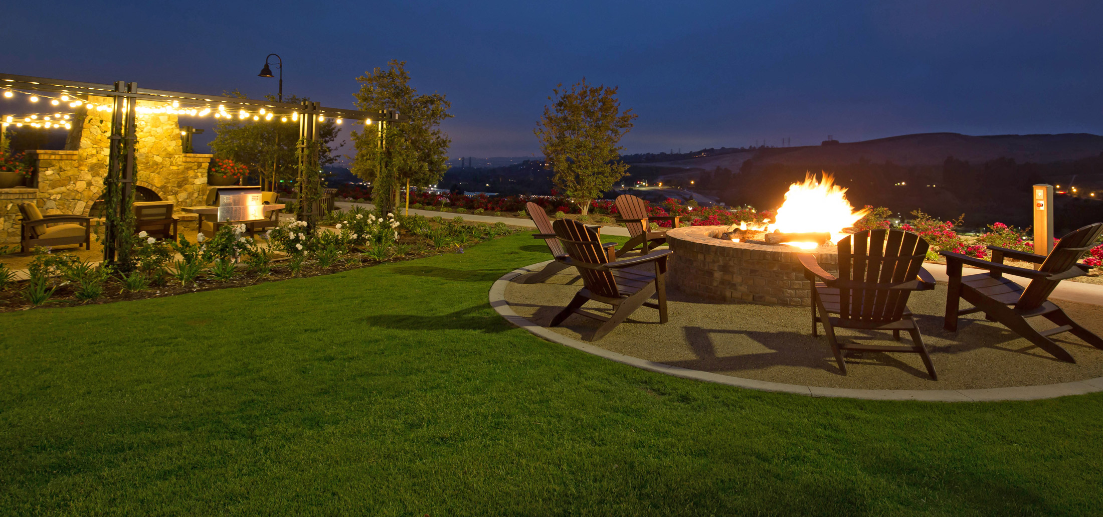 Fire pit lounge area with grilling station