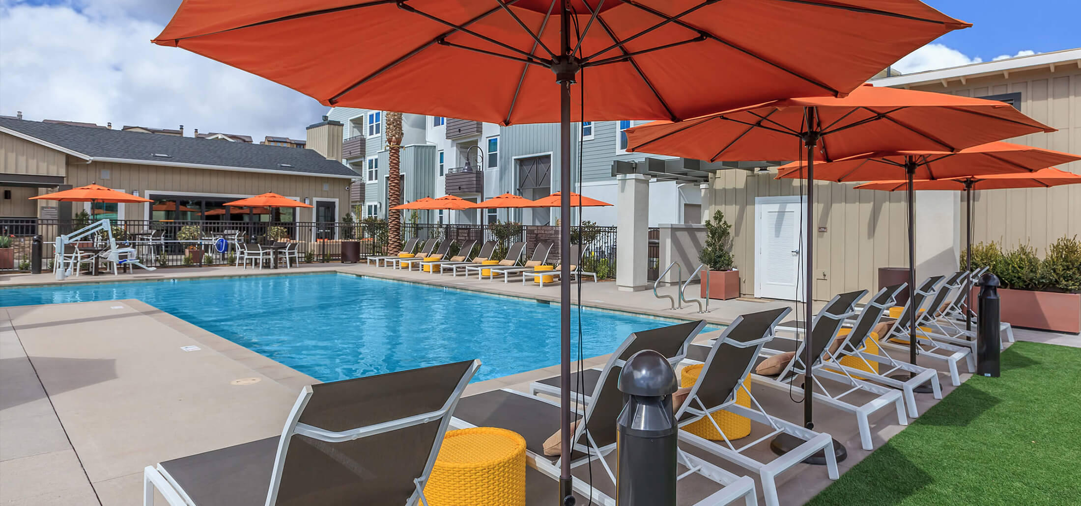 Pool area with umbrellas and seating